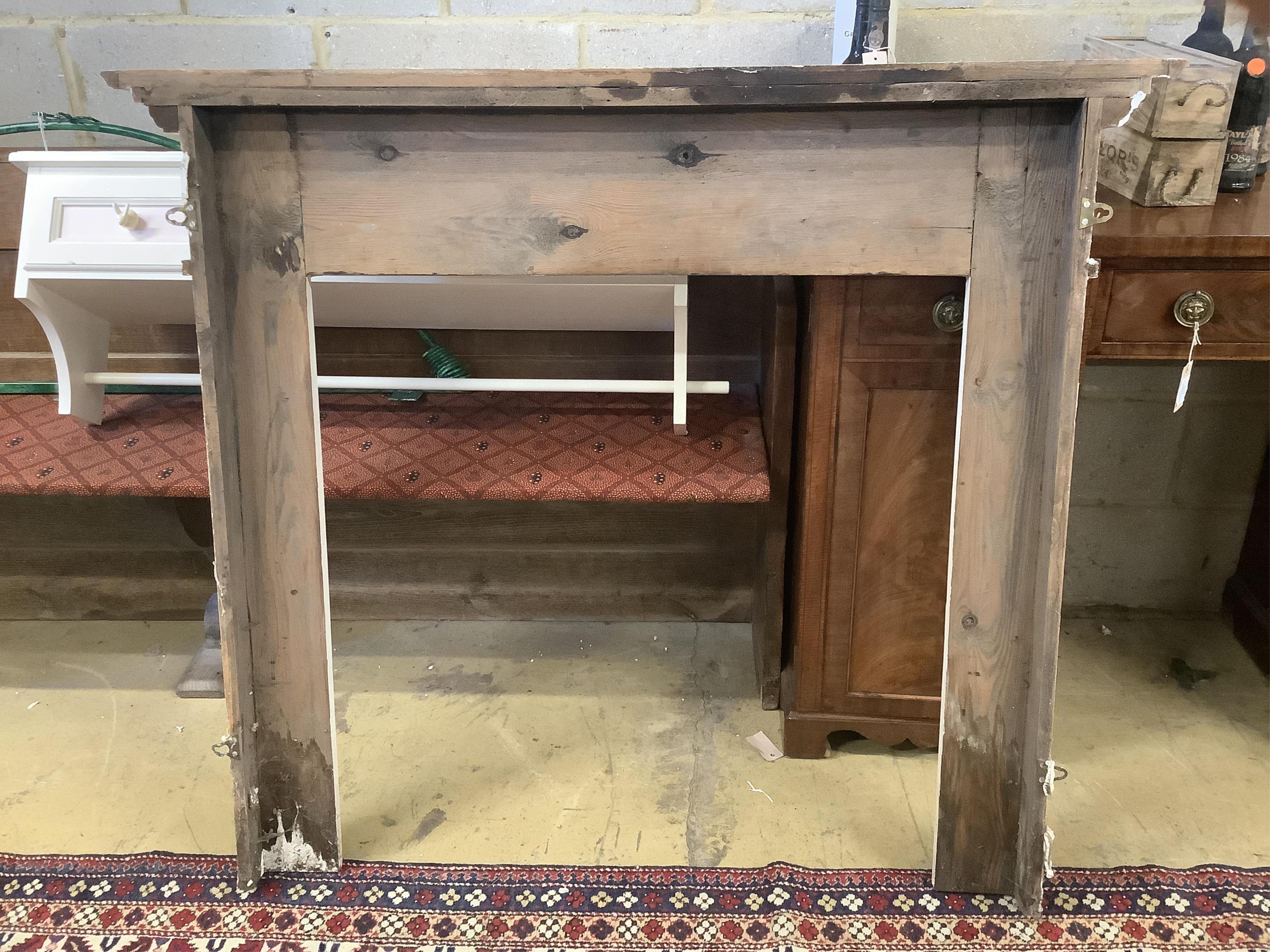 An 18th century style painted pine fire surround and one other, larger width 138cm, height 116cm. Condition - fair